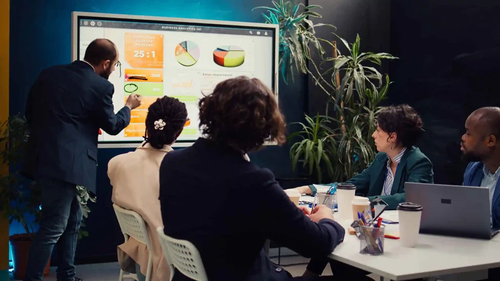 Interactive digital signage in a corporate meeting room enhances team collaboration and engagement.